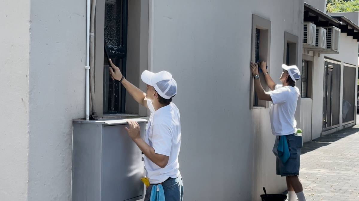 Peak Cleaning technicians cleaning windows on a Pretoria property