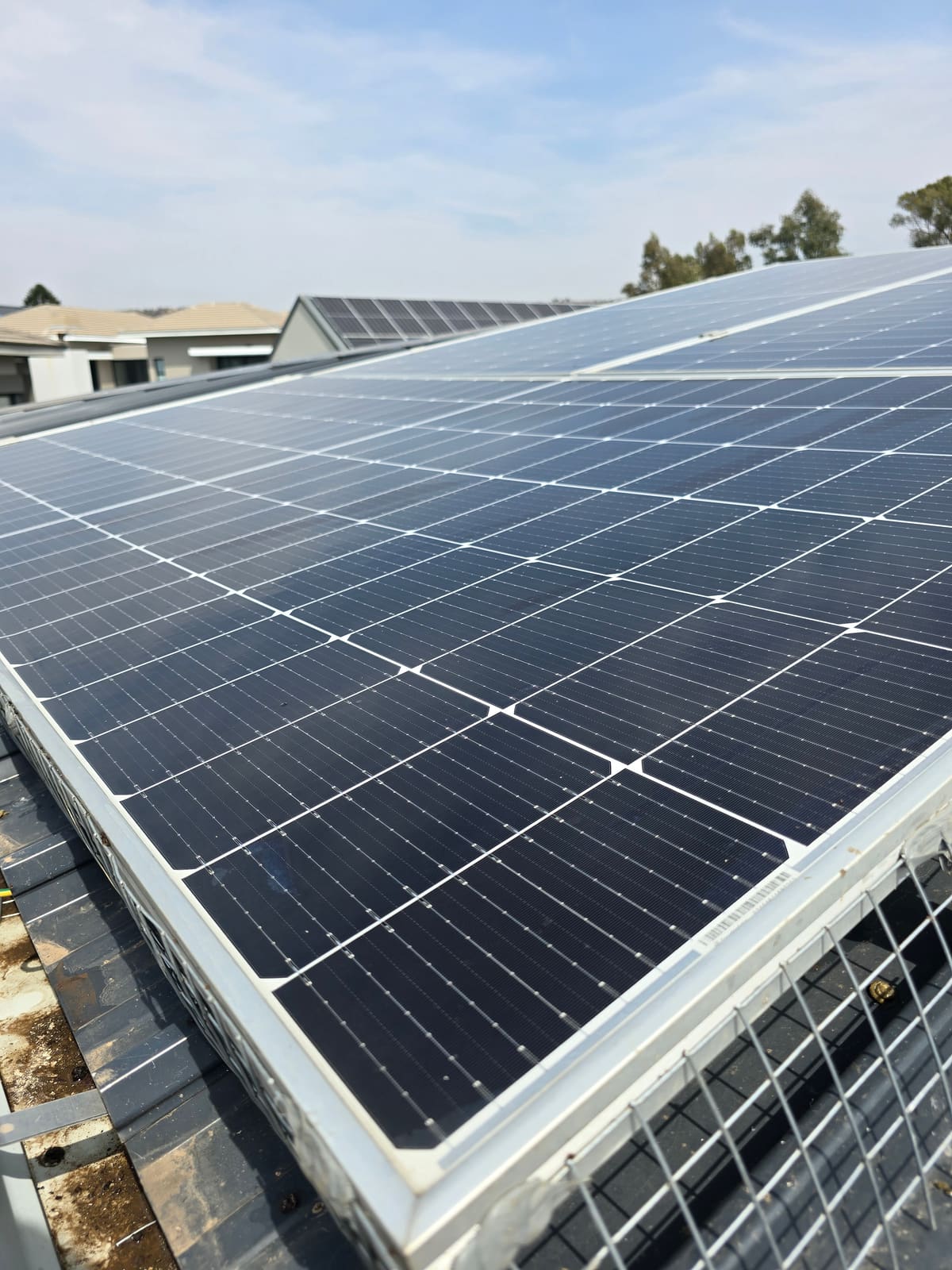 Same solar panel restored to full clarity after cleaning
