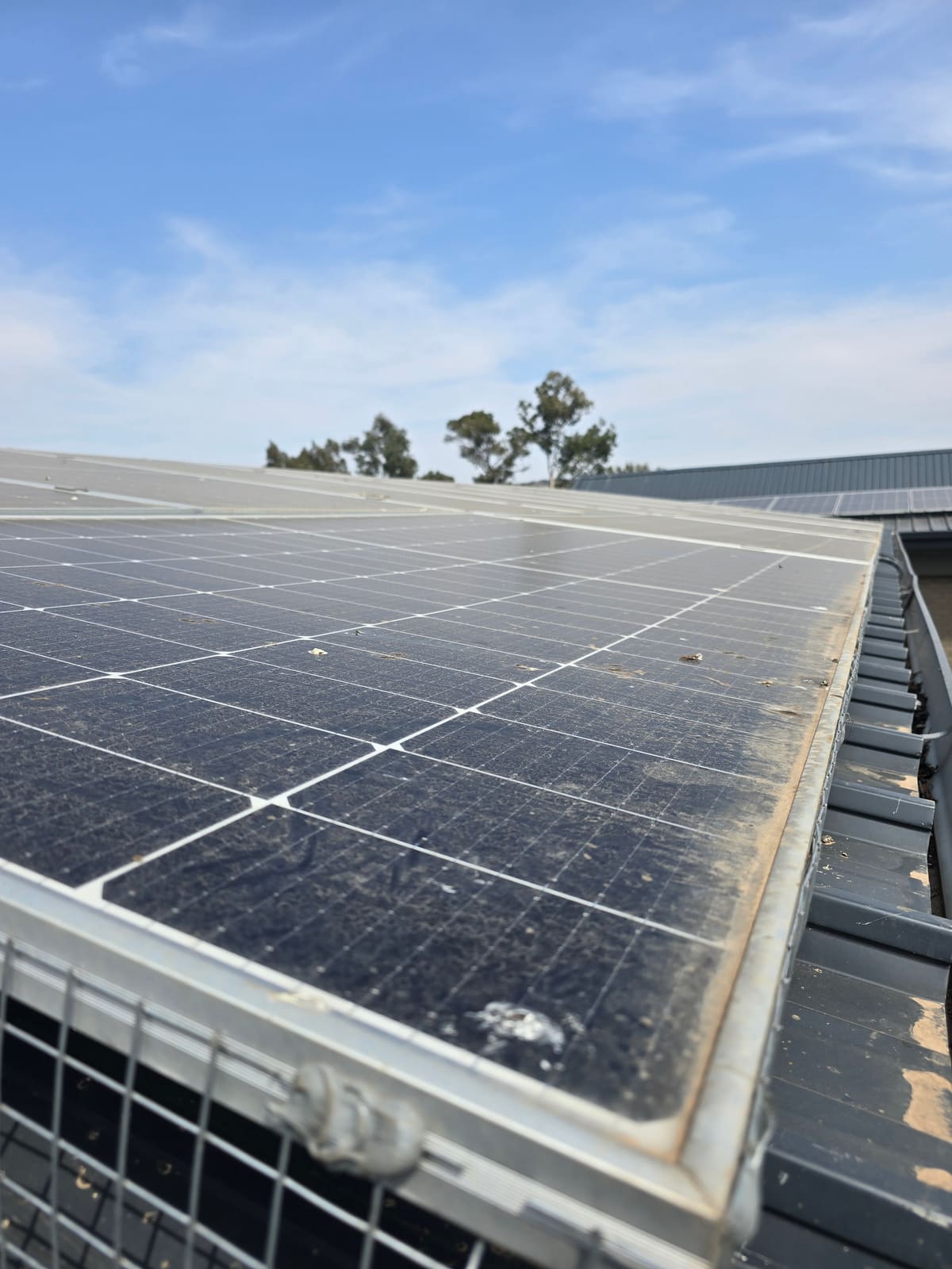 Dusty solar panel edge before cleaning